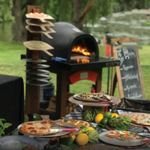 HPC Pizza Oven in back with food in front