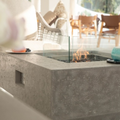 Gray Manhattan Ethanol Fire Table with flame and windscreen outdoor